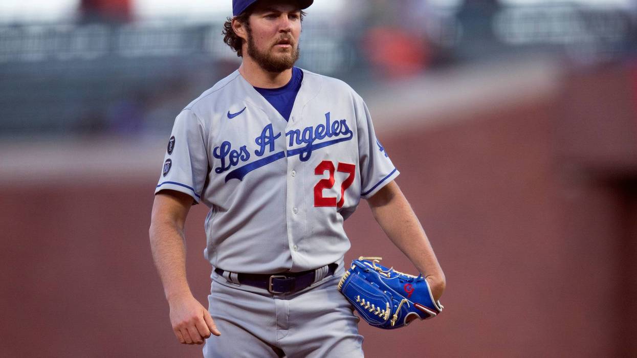FILE - Los Angeles Dodgers starting pitcher Trevor Bauer looks toward home during the fourth inning of the the team's baseball game against the San Francisco Giants on May 21, 2021, in San Francisco. Bauer's administrative leave was extended Friday, March 11, 2022, for a week by Major League Baseball and the players' association.
