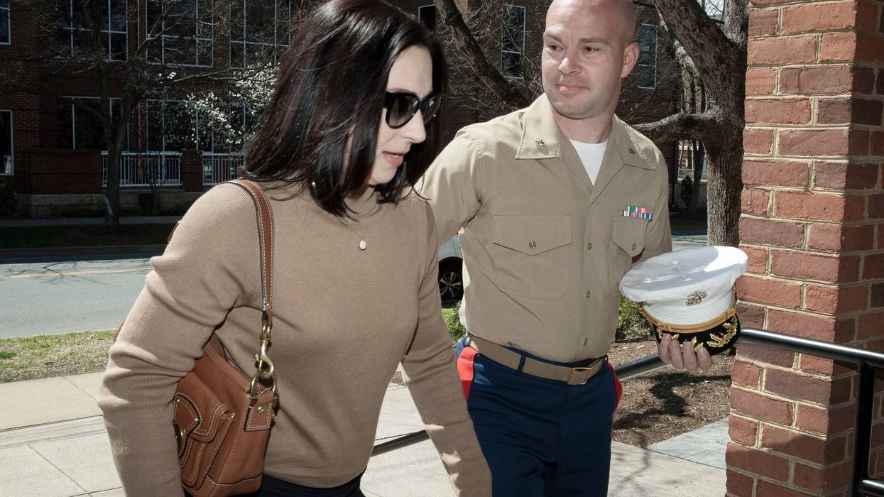 FILE - Marine Maj. Joshua Mast and his wife, Stephanie, arrive at Circuit Court, Thursday, March 30, 2023 in Charlottesville, Va.