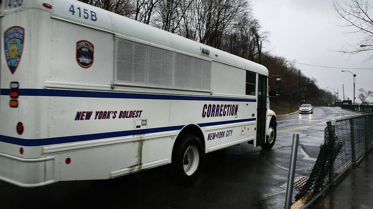 File photo: A corrections bus enters Rikers Island