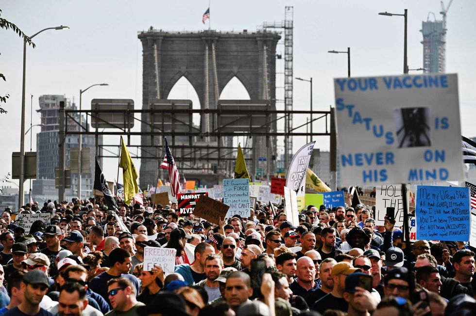 File photo: New York City municipal workers and supporters march across the Brooklyn Bridge during the "Anti-Mandate March For Choice", New York, NY, October 25, 2021