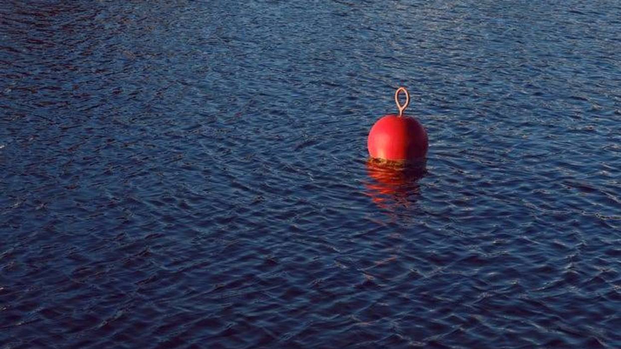 file photo of a red buoy on a lake