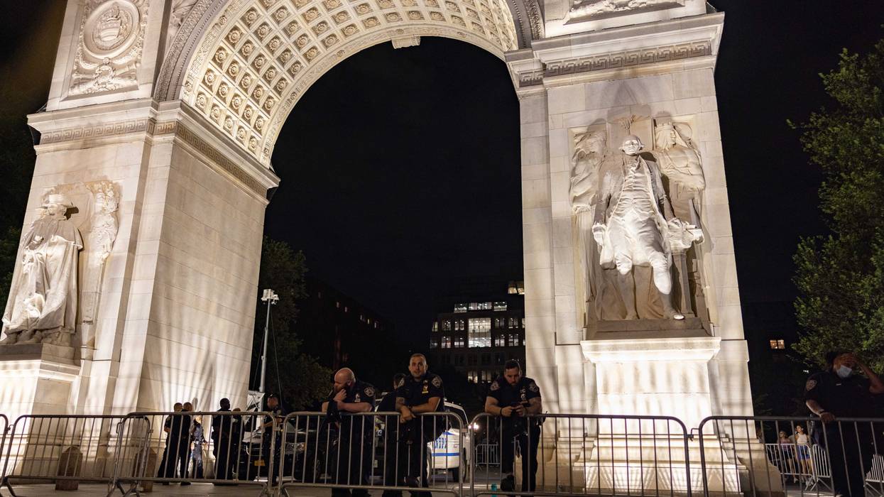 File photo: Police set up a perimeter beneath the archway of Washington Square Park on June 18, 2021 in New York City