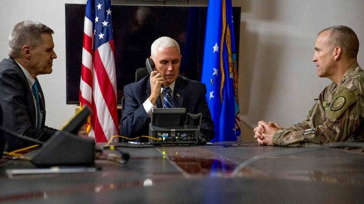 File photo Vice President Mike Pence, accompanied by U.S. Ambassador to Iraq Matthew Tueller, left, and Lt. Gen. Pat White, right, takes a phone call with Iraqi Prime Minister Adil Abdul-Mahdi at Al Asad Air Base, Iraq. (AP Photo/Andrew Harnik, File)