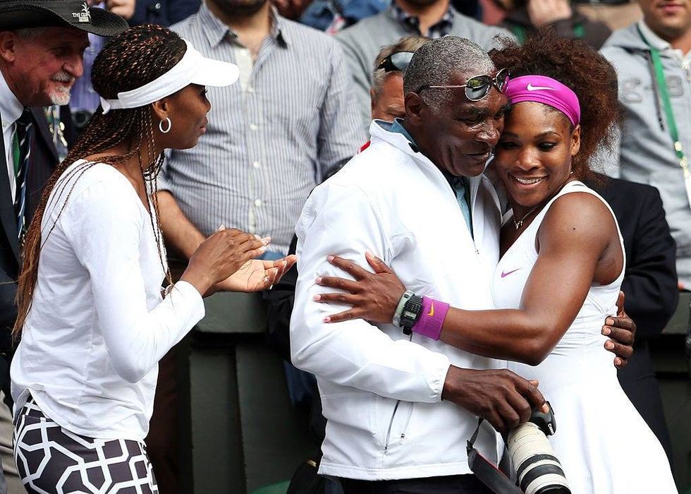 FILE - Serena Williams (R) of the USA celebrates with her father Richard Williams and sister Venus Williams after her Ladies’ Singles final match against Agnieszka Radwanska of Poland on day twelve of the Wimbledon Lawn Tennis Championships at the All England Lawn Tennis and Croquet Club on July 7, 2012 in London, England.