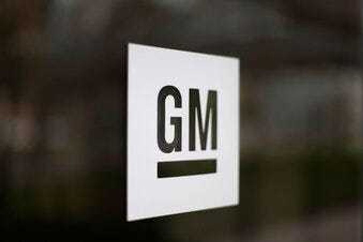 FILE - This Friday, May 16, 2014, file photo, shows the General Motors logo at the company's world headquarters in Detroit. (AP Photo/Paul Sancya, File)