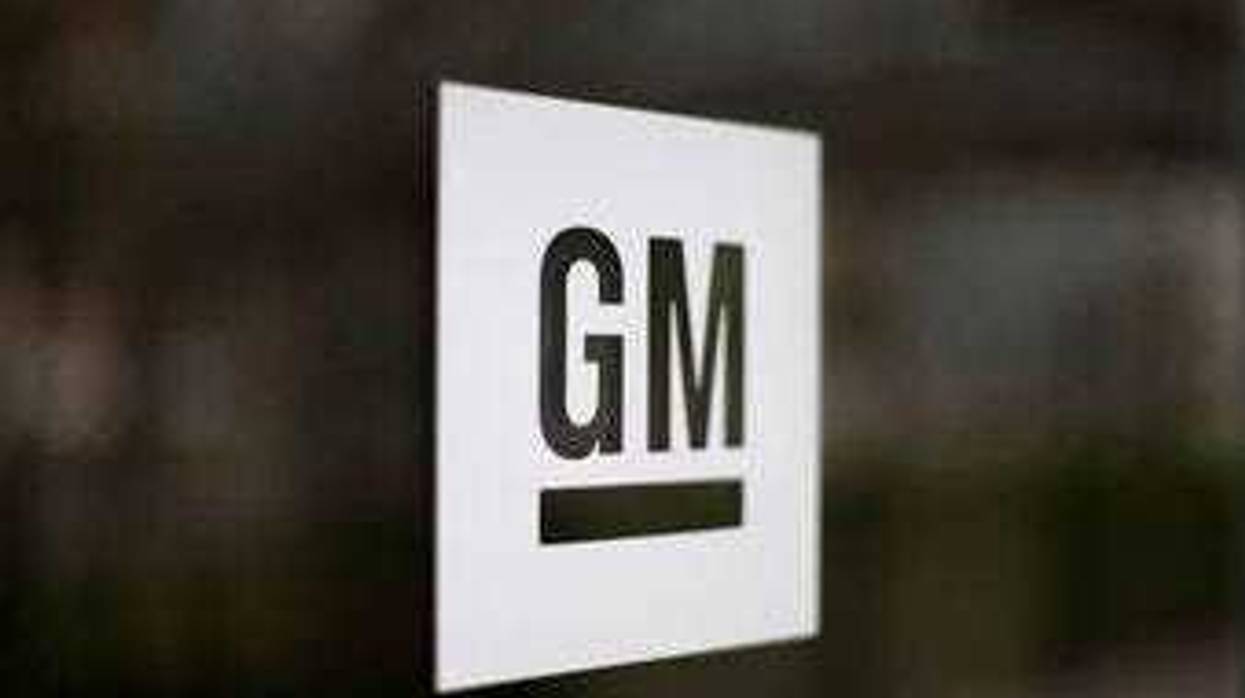 FILE - This Friday, May 16, 2014, file photo, shows the General Motors logo at the company's world headquarters in Detroit. (AP Photo/Paul Sancya, File)
