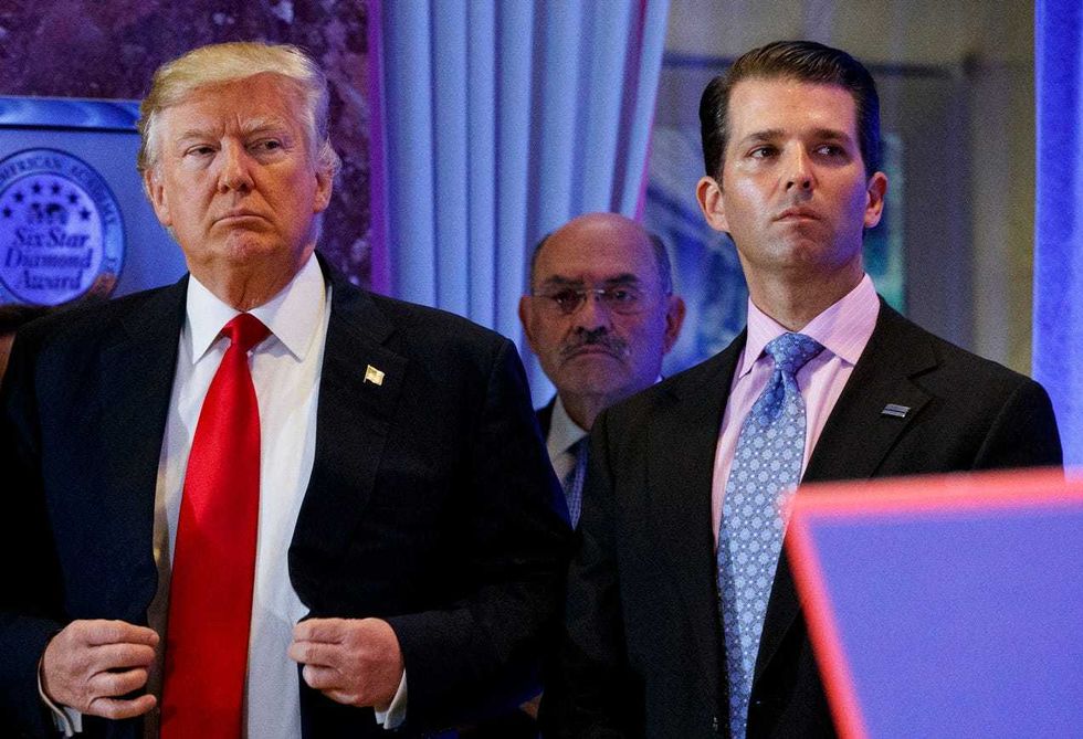 File: This Jan. 11, 2017, shows President-elect Donald Trump, left, his chief financial officer Allen Weisselberg, center, and his son Donald Trump Jr., right, attend a news conference in the lobby of Trump Tower in New York