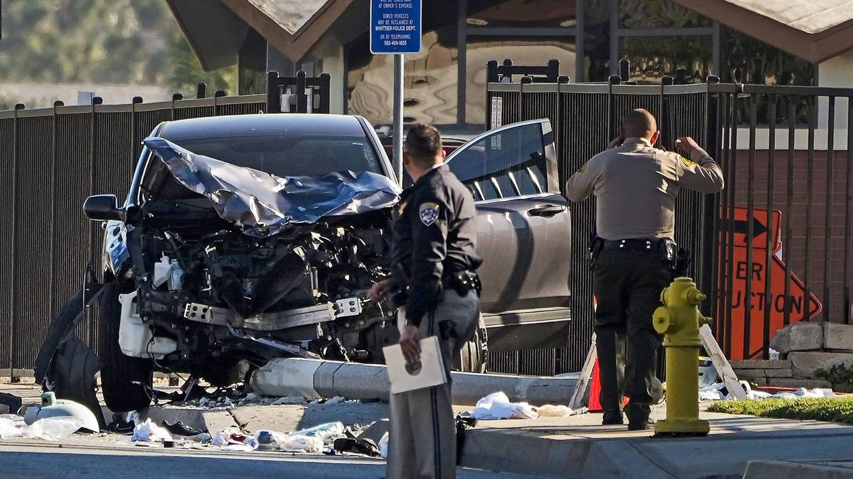 FILE - Two investigators stand next to a mangled SUV that struck Los Angeles County sheriff's recruits in Whittier, Calif., Wednesday, Nov. 16, 2022. One of the Los Angeles County law enforcement recruits struck by the SUV during a training run last week was in deteriorating condition Sunday, Nov. 20. The Los Angeles County Sheriff's Department says in a statement that Alejandro Martinez has suffered setbacks that have left him in grave condition. The department says three other members of the sheriff's academy class remain in critical condition.