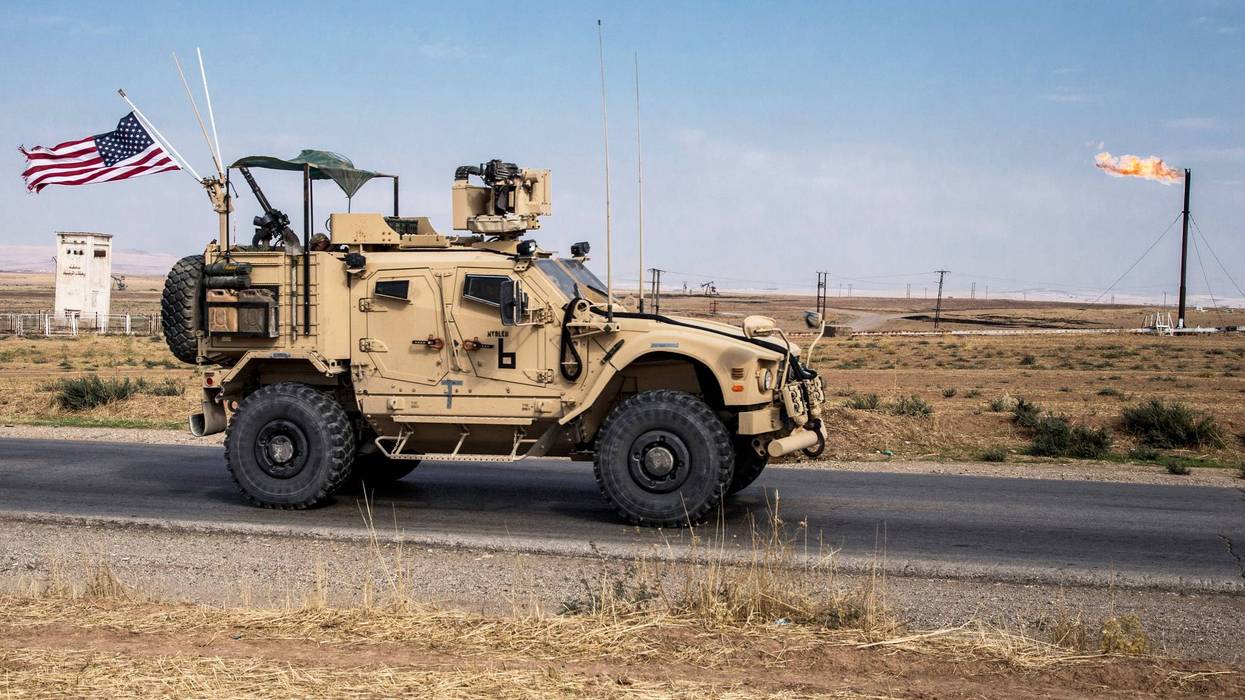 FILE - U.S. forces patrol oil fields in Syria, Oct. 28, 2019.