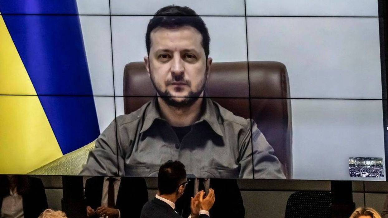 FILE - Ukrainian President Volodymyr Zelensky addresses the Bundestag via live video from the embattled city of Kyiv on March 17, 2022 in Berlin, Germany. Zelensky has been pleading NATO member states to enforce a no-fly zone over Ukraine, which NATO has so far declined, citing the need to avoid a direct military confrontation with Russia.