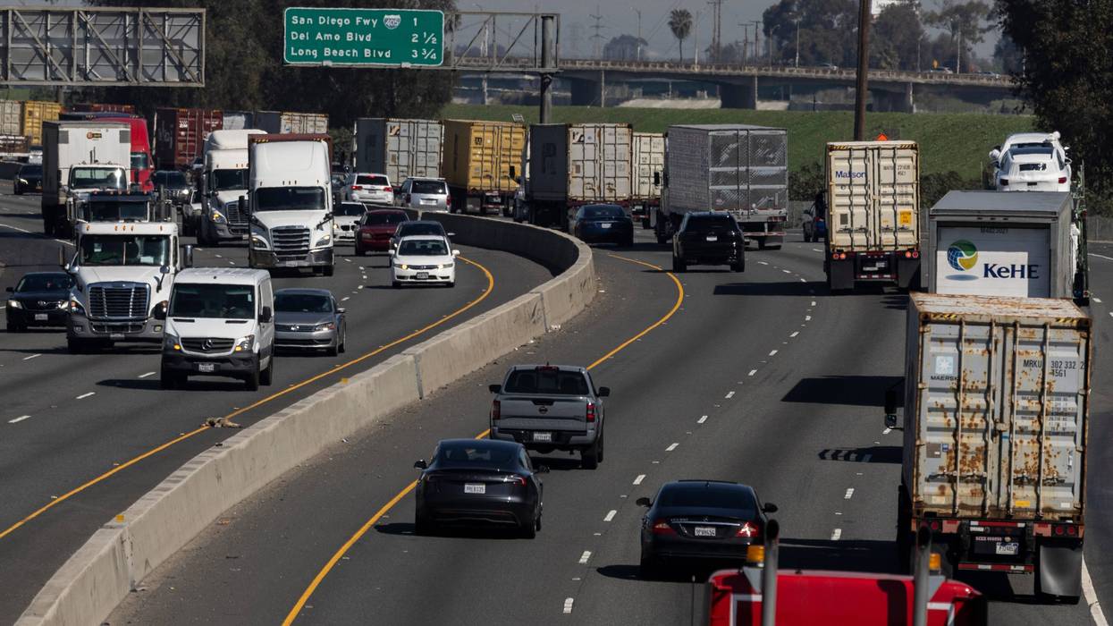 FILE - Vehicles move along the 710 highway near the Ports of Los Angeles and Long Beach, Monday, March 10, 2025, in Long Beach, Calif.