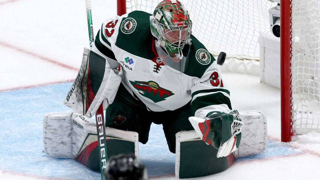 Filip Gustavsson #32 of the Minnesota Wild blocks a shot on goal against the Dallas Stars in the first overtime period in Game One of the First Round of the 2023 Stanley Cup Playoffs at American Airlines Center on April 17, 2023 in Dallas, Texas.