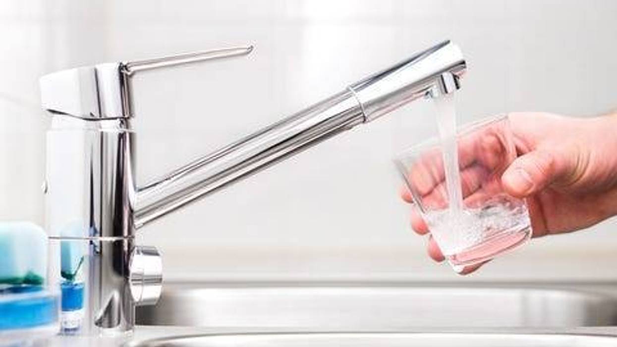 Filling glass with tap water