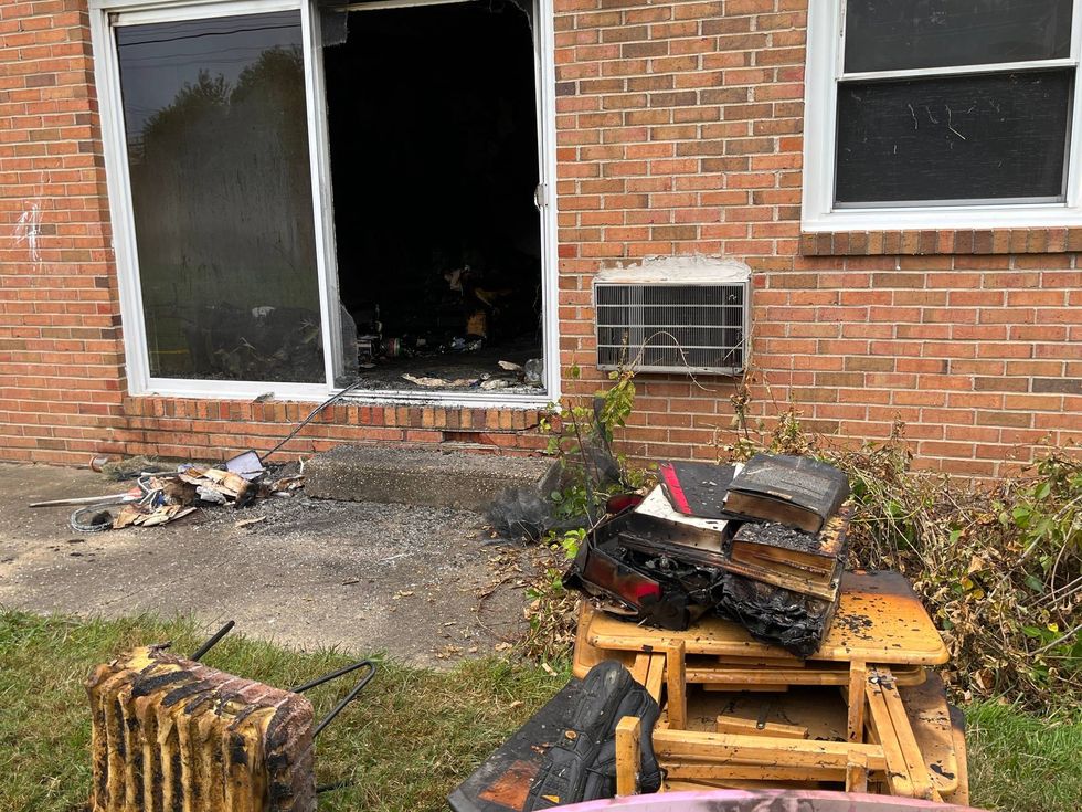 Fire crews removed the charred remains of debris, including a lot of paper items, from the apartment.