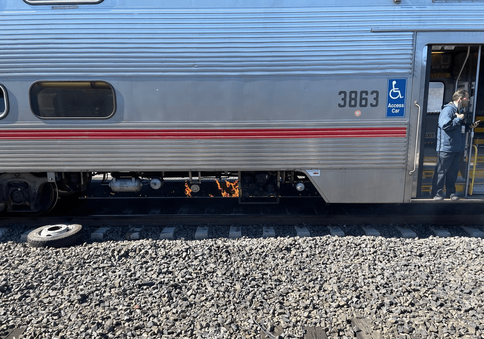 Fire seen underneath the Caltrain shortly after the crash.