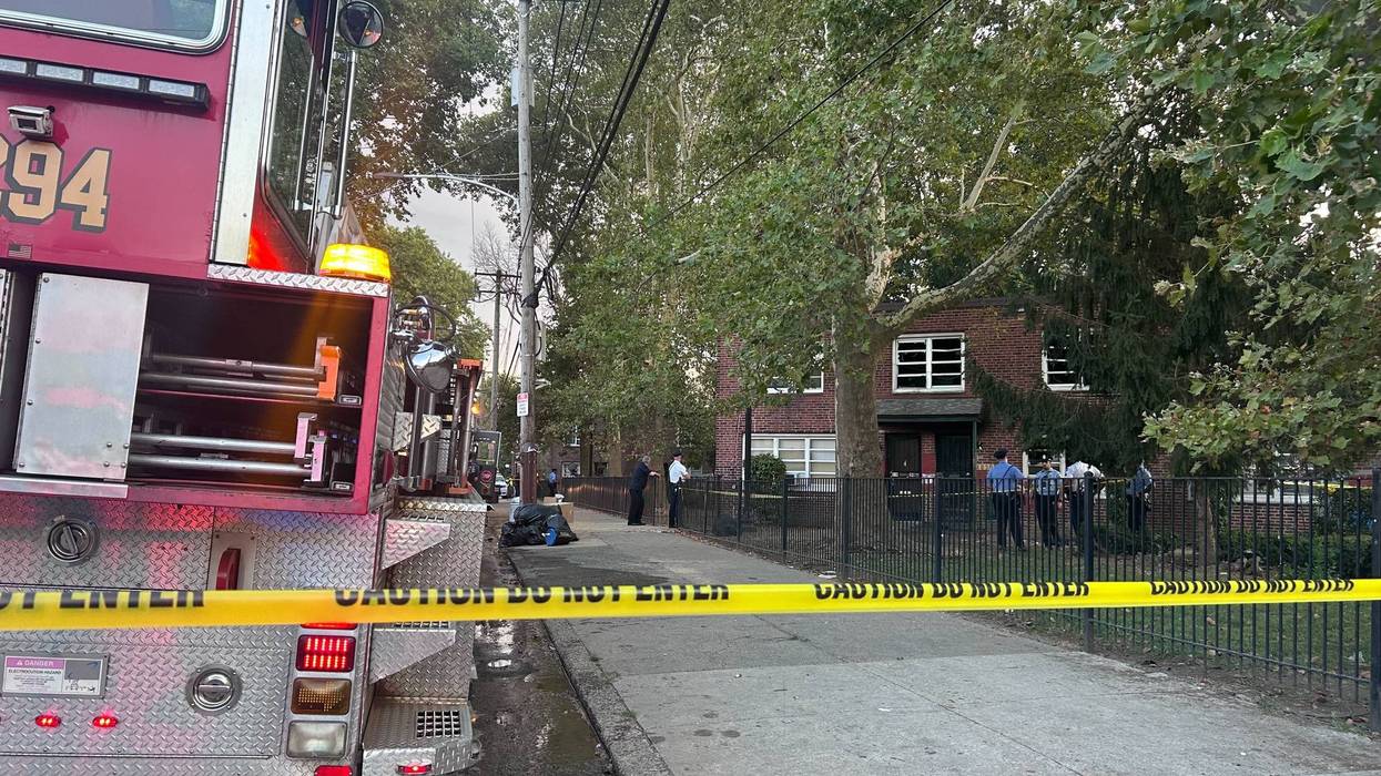 Fire truck in front of house fire investigation scene