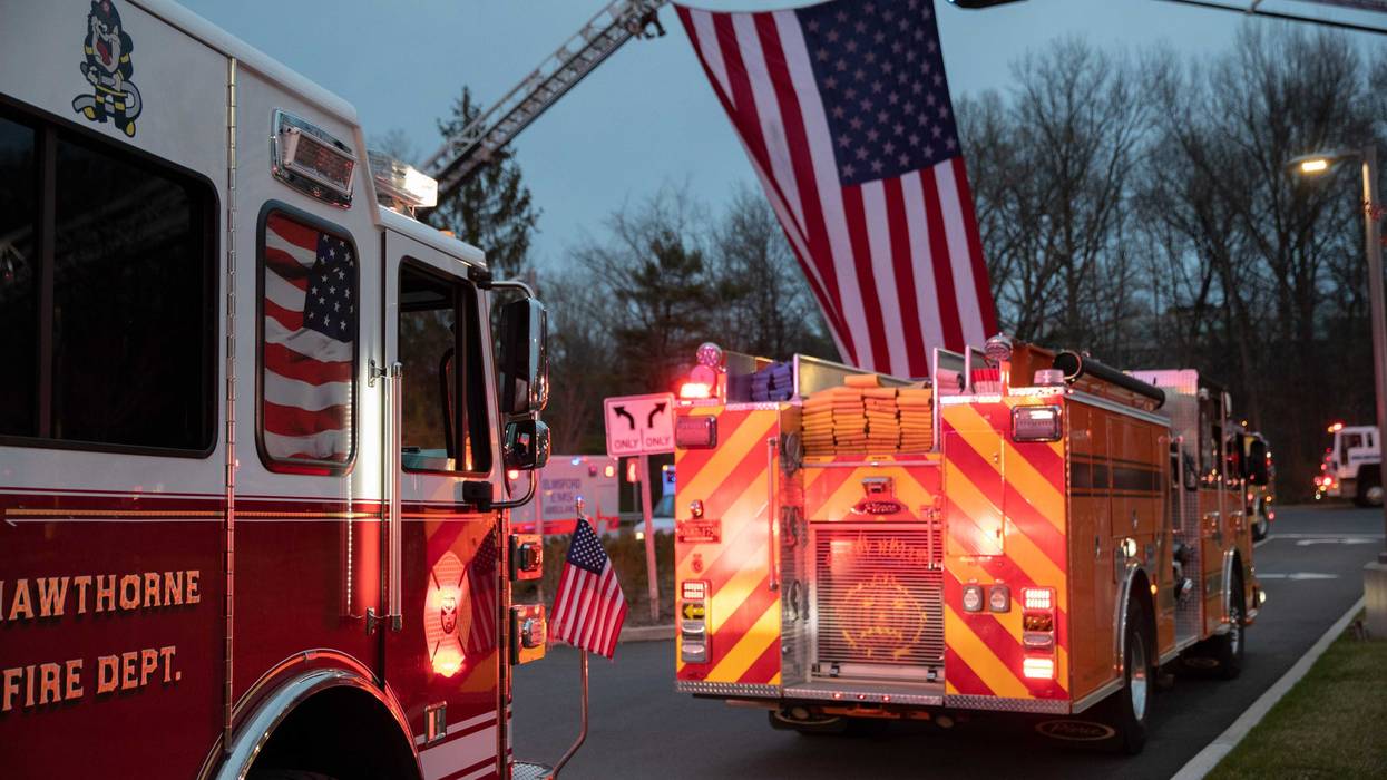 Fire trucks depart the Westchester Medical Center on April 14, 2020 in Valhalla, New York during the coronavirus crisis.