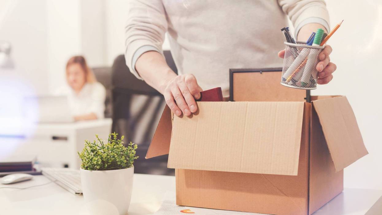 fired worker packing up desk