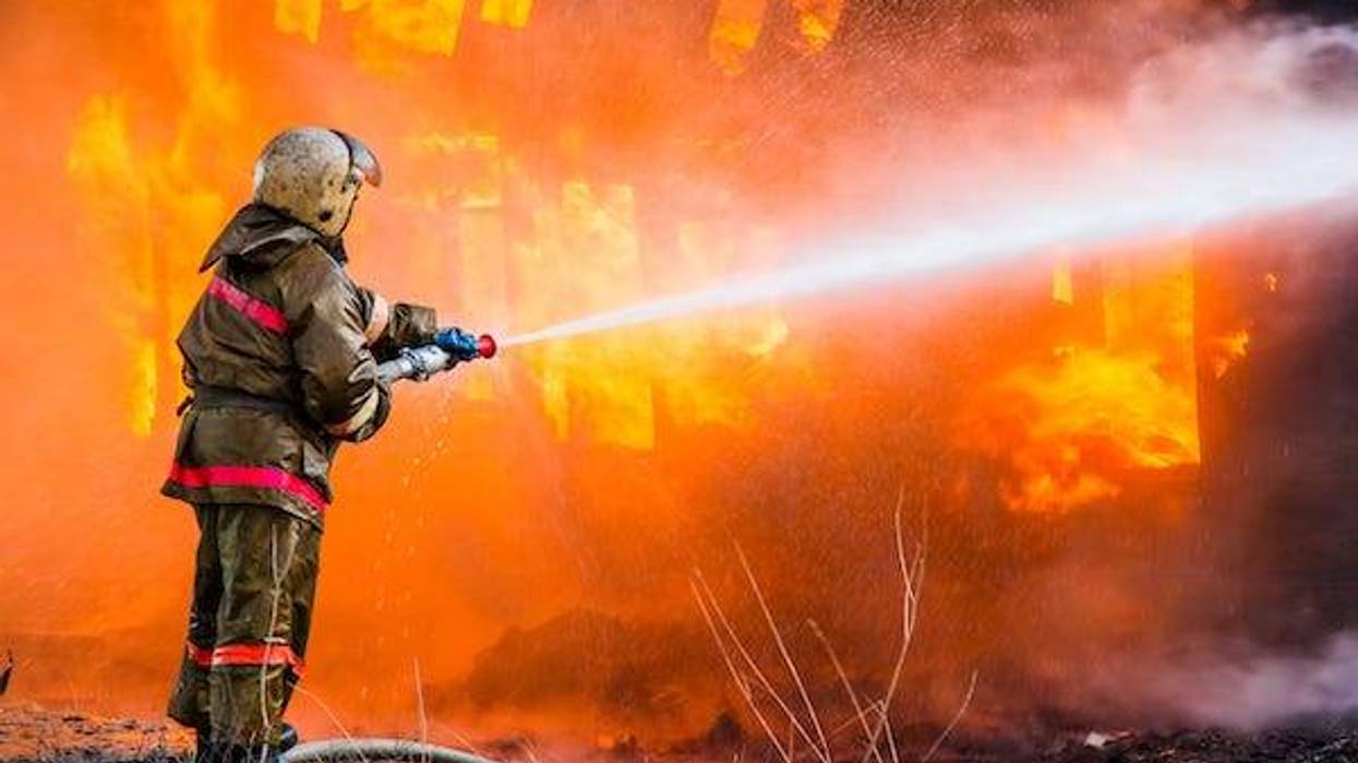 Firefighter extinguishing a fire