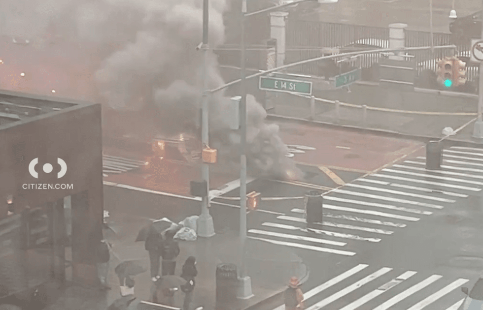 Firefighters arrived on scene and report a smoking manhole at the intersection.