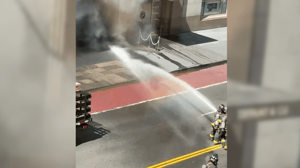Firefighters battle a smoky fire at the Tiffany & Co. flagship in Midtown