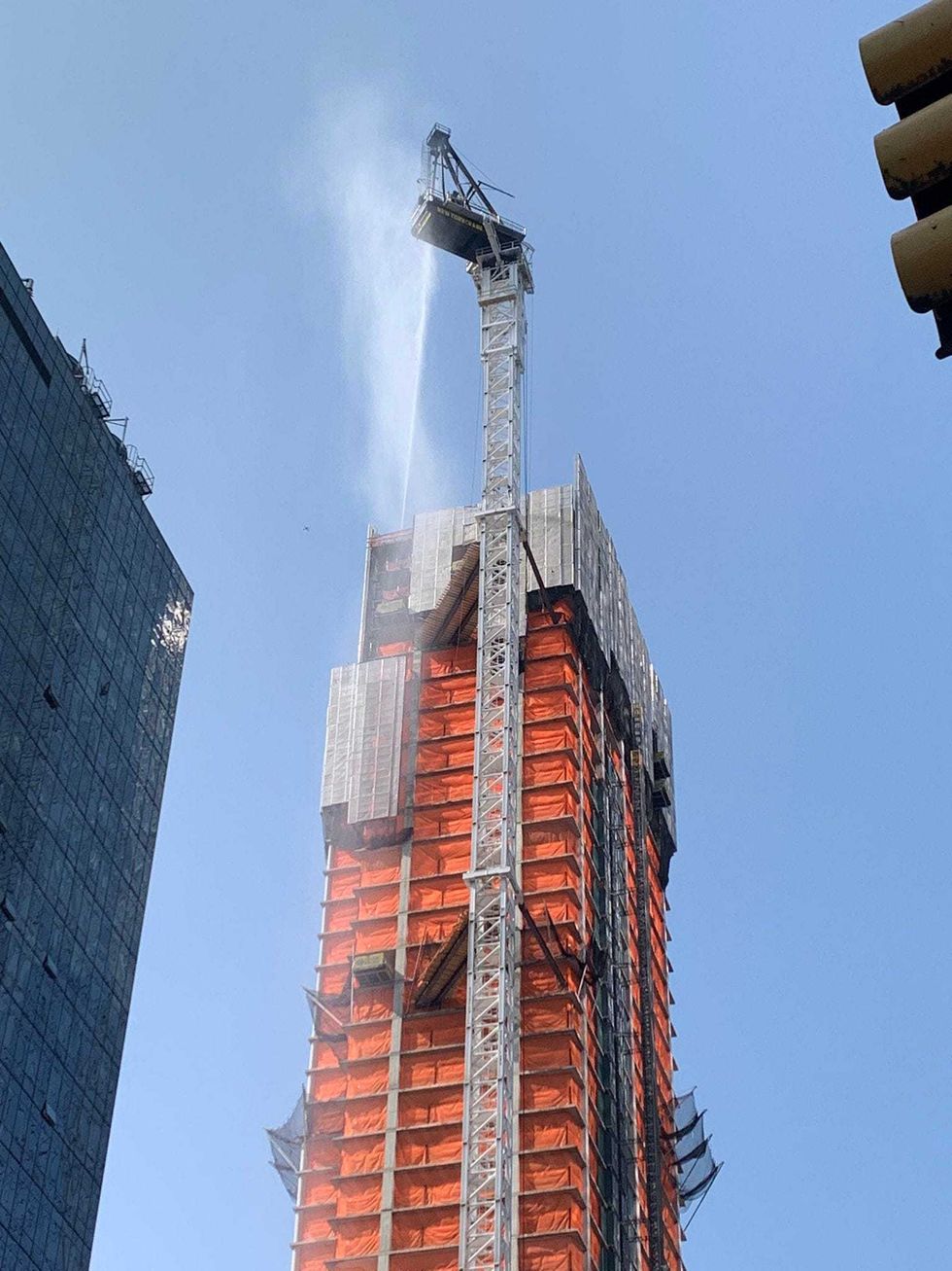 Firefighters continued to douse the crane throughout the morning