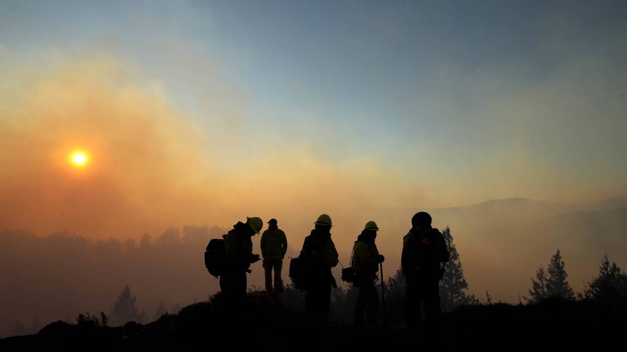 Firefighters monitor the Kincade Fire on October 29, 2019 in Healdsburg.