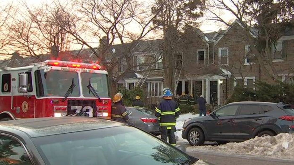 Firefighters on scene following a fire Saturday morning in East Mount Airy that left one person dead and another in critical condition.