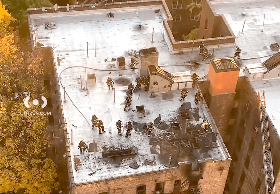 Firefighters on the roof of the six-story apartment building