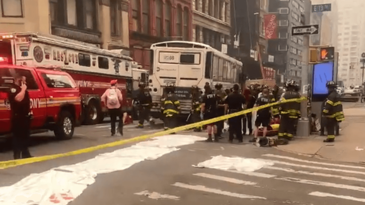 Firefighters responded to the scene after a woman was hit and killed by an MTA bus.