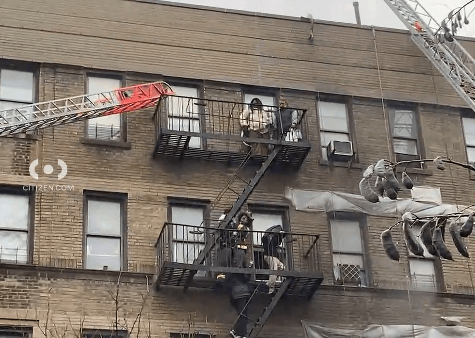 Firefighters were seen helping people out of windows