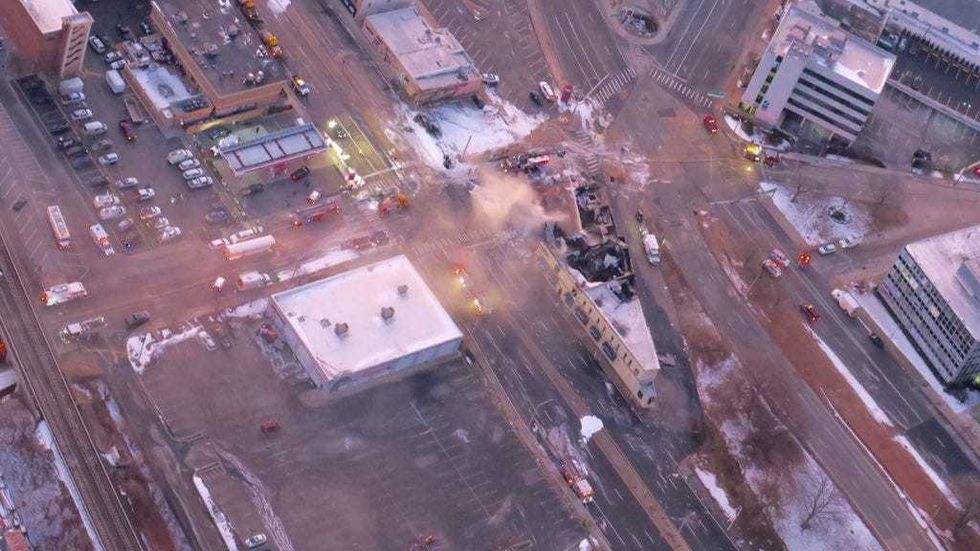Firefighters were still dousing pockets of fire and smoke at sunrise Wednesday