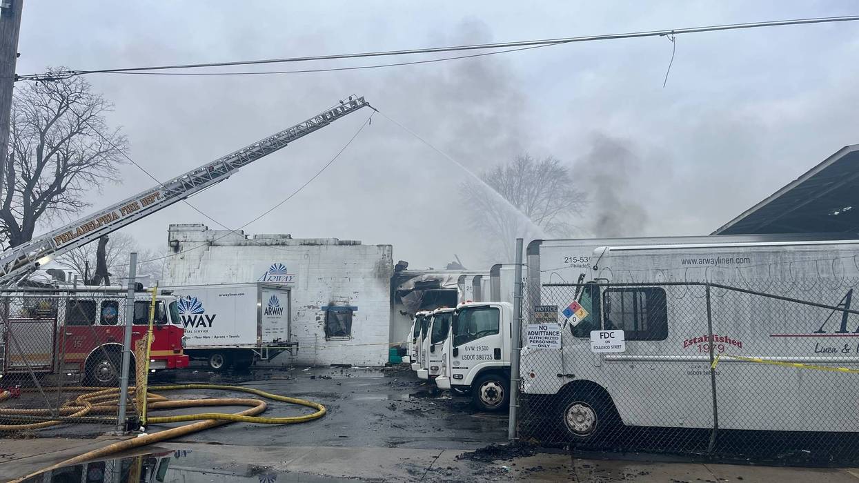 Firefighters work to extinguish a fire in the city's Frankford neighborhood.