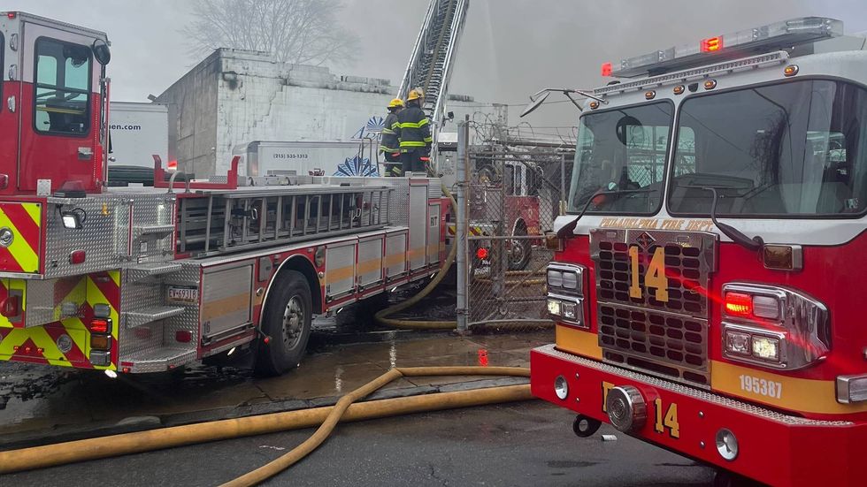 Firefighters work to extinguish a fire in the city