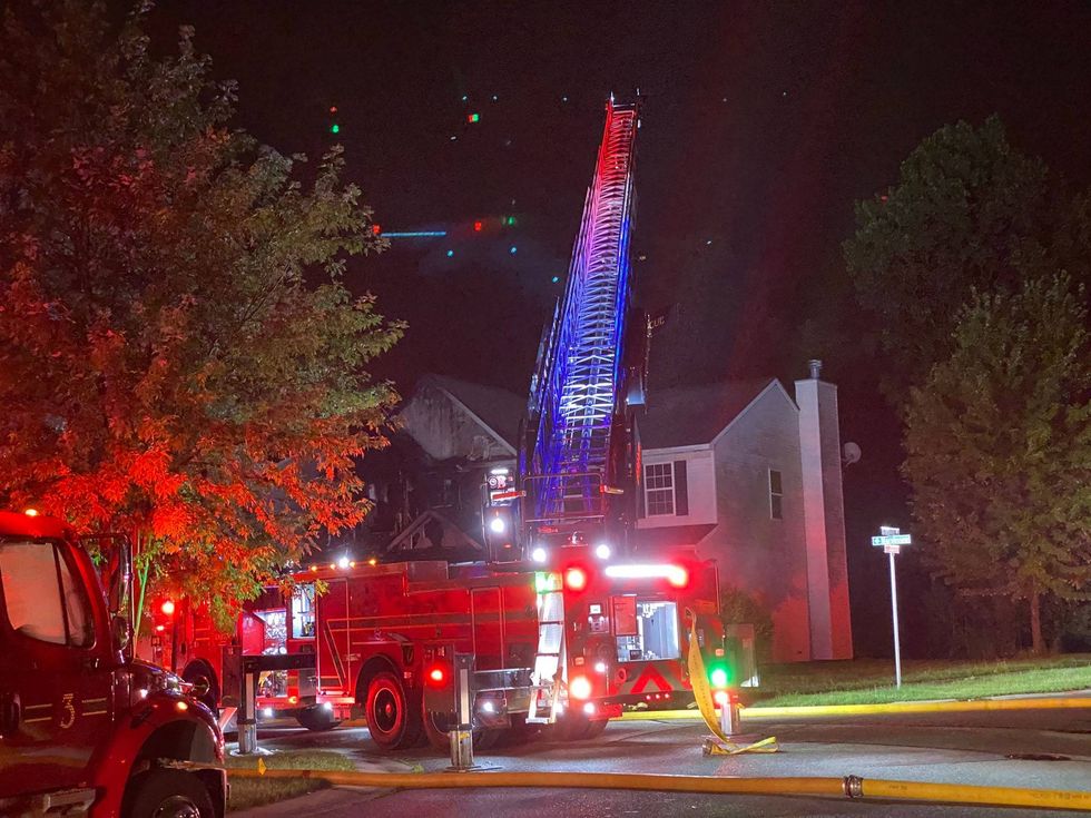 Firetruck in front of burning house