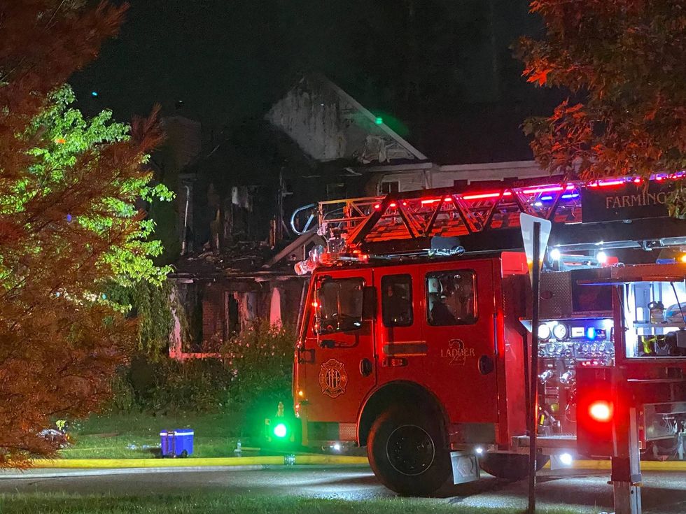Firetruck in front of damaged home