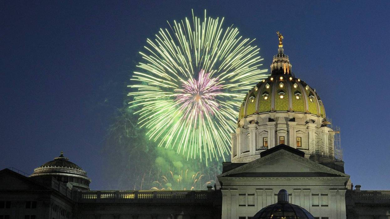 Fireworks explode over the Pennsylvania state Capitol building.