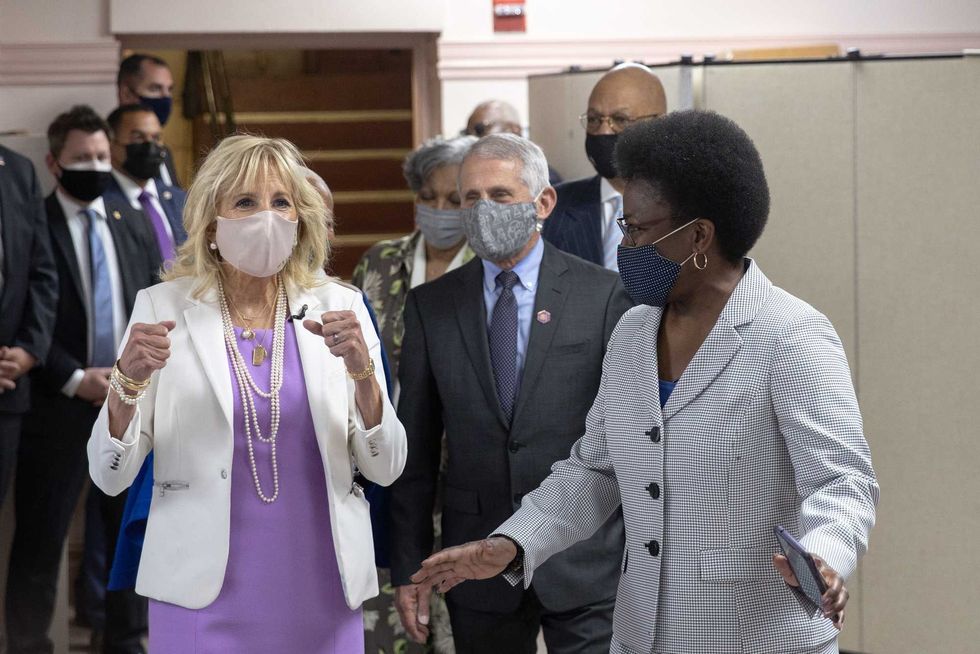 First Lady Dr. Jill Biden (L) and Dr. Anthony Fauci (C), Director of the National Institute of Allergy and Infectious Diseases, speak with members of the Abyssinian Baptist Church on June 6, 2021 in New York City