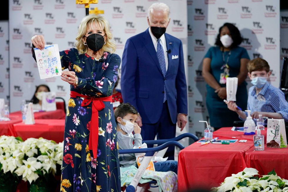 First Lady Jill Biden displays a lantern made by a patient at Children