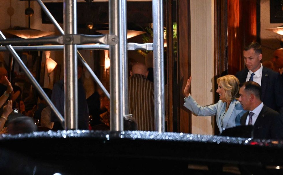 First lady Jill Biden waves to the crowd as she leaves the restaurant Il Cantinori in Greenwich Village on Sept. 17, 2023