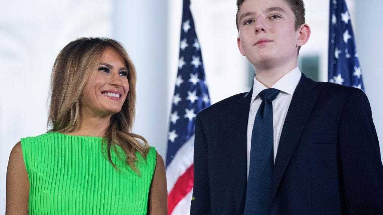 First lady Melania Trump (L) looks at her son Barron Trump after U.S. President Donald Trump delivered his acceptance speech for the Republican presidential nomination on the South Lawn of the White House August 27, 2020 in Washington, DC.