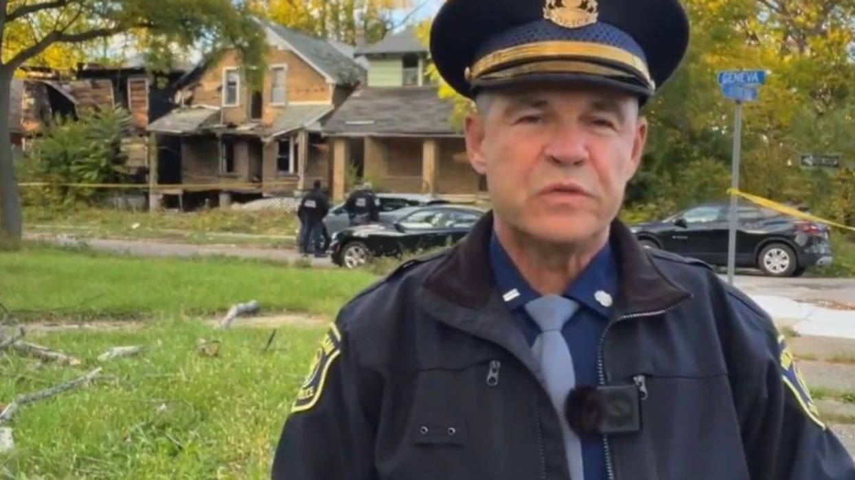 First Lt. Mike Shaw in front of abandoned home
