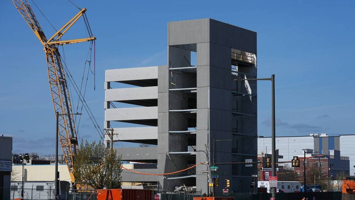 First responders inspect a partially collapsed parking garage in Philadelphia, Thursday, April 9, 2026. (AP Photo/Matt Rourke)