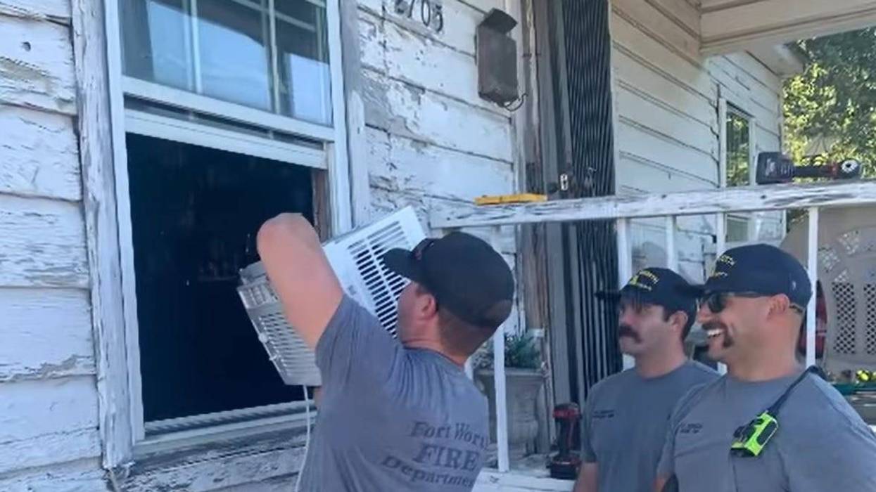 First responders install a free air conditioner for an elderly Fort Worth woman
