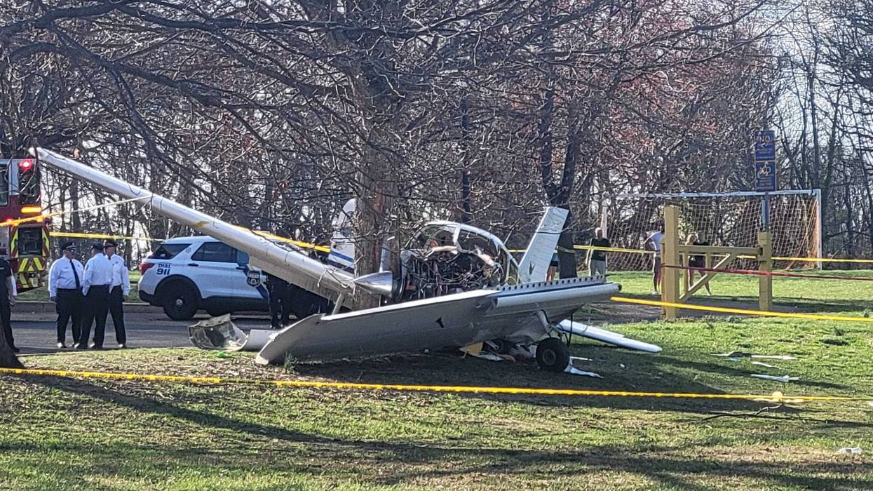 First responders surround the wreckage of a small plane that crash-landed in Fluehr Park in Northeast Philadelphia.
