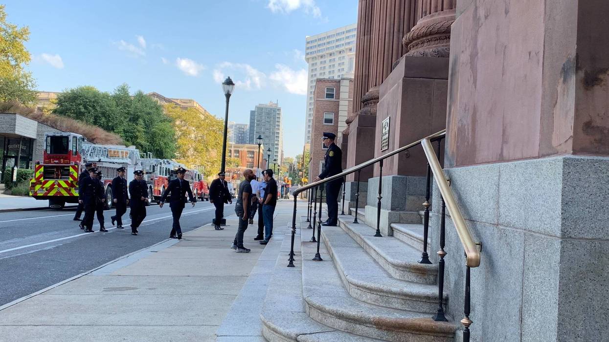First responders walking into the Cathedral Basilica of Saints Peter and Paul for Blue Mass.