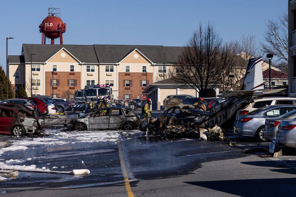 First responders work the scene after a plane crashed in the parking lot of a retirement community in Manheim Township, Pa., on March 9, 2025.