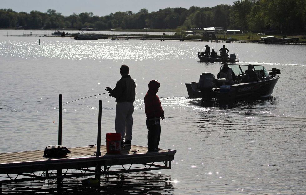 Fisherman on docks and in boats shared the waters of South Lindstrom Lake near the public boat launch during the fishing opener in Lindstrom, Minnesota, May 12, 2012.