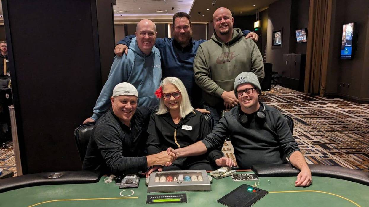 Five of the Texas Hold’em poker players from Rivers Casino Pittsburgh on Nov. 28 who will share a $905,622.13 jackpot. Front row (left to right): Brent Enos, Evelyn Gussenhoffen (dealer) and Scott Thompson. Back row (left to right): Frederick Humelsine, Kevin Graham and Daniel Stefancin.