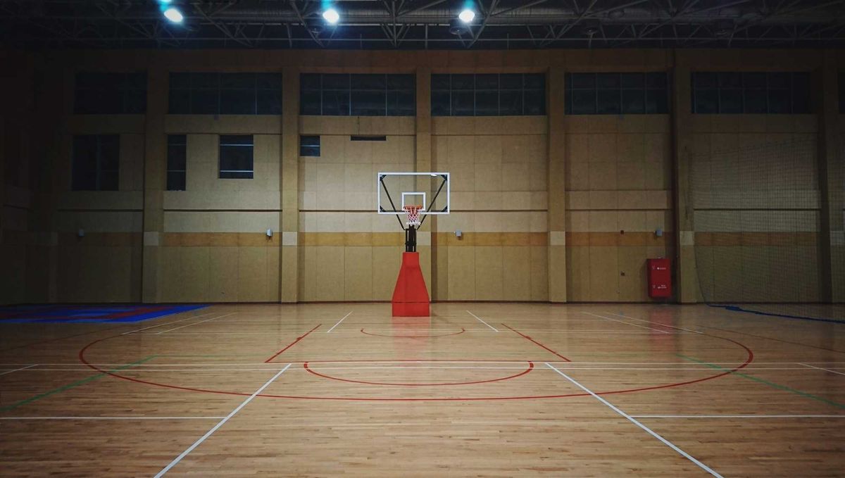 Five people are under arrest after an assault at a north metro high school basketball game Tuesday night.